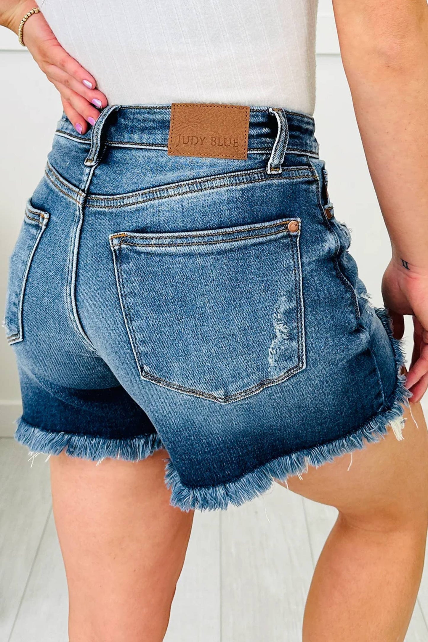 Asymmetric Raw Hem Distressed Whiskery Denim Shorts