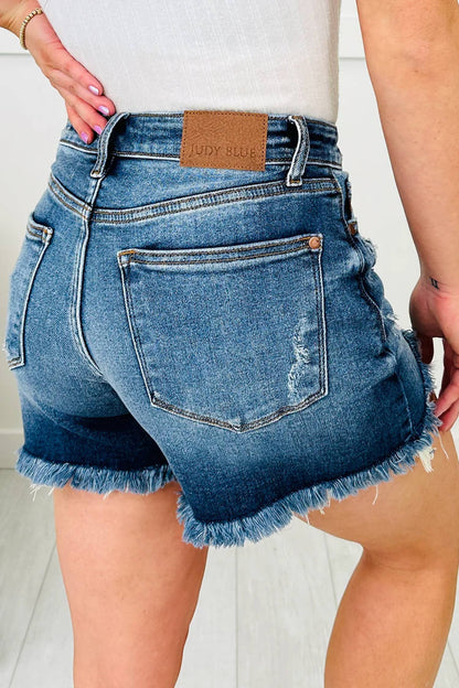 Asymmetric Raw Hem Distressed Whiskery Denim Shorts